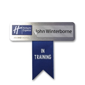 Name badge with "in training" ribbon